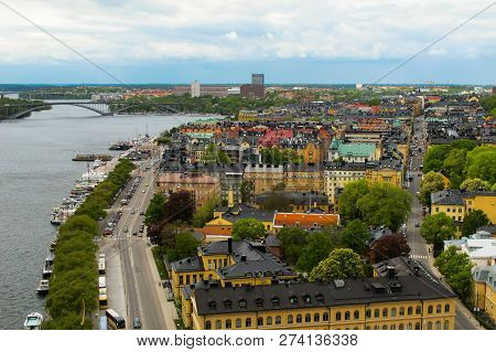 Sweden Stockholm. View Of The Cityscape, Roads, Bridges And Pier With Boats From Observation Deck Of