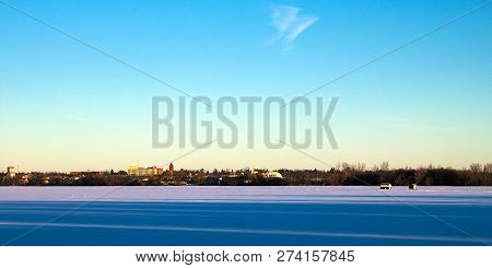 Winter Fishing Houses On Frozen Lake Irving In Bemidji, Minnesota On A Clear December Morning With T
