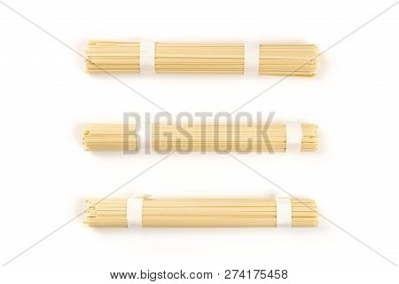 Three Individually Wrapped Portions Of Udon Noodles, Shot From The Top On A White Background With A 