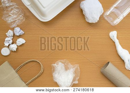 Top View Of Recycling Garbage Waste On Wooden Background With Center Copy Space , Eco And Save World