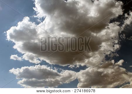 Sunny Day. The Sun Through The Clouds