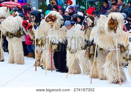 Razlog, Bulgaria - January 14, 2017: People In Traditional Carnival Kuker Costumes With Bells At Kuk