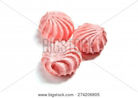 Three Meringue Cookies. Meringues Kisses In Pink Color. Airy And Practically Weightless Biscuits Bas