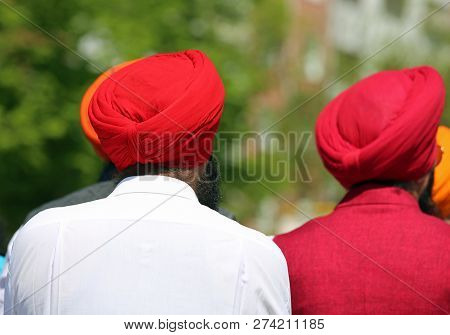 Two Indian Men With Red Turbants Outdoors