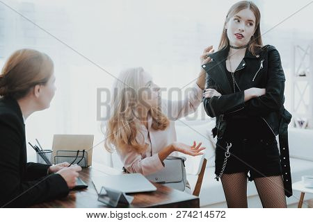 Upset Teenage Daughter In Jacket In Psychologist Office With Mother. Punk In Lather Jacket. Communic