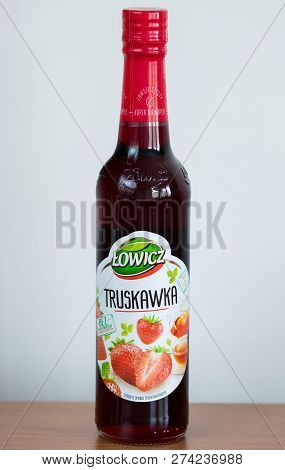 Pruszcz Gdanski, Poland - December 15, 2018: Lowicz Strawberry Juice In A Glass Bottle On Wooden Tab