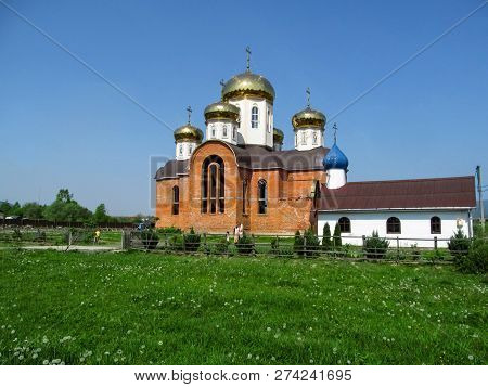 Ukraine, Khust - May 1, 2018: Unfinished Orthodox Temple With Golden Domes On Ivan Chendey Street In