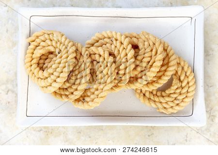 Chakli Or Murukku Popular Vegetarian Snack South India. Spiral Shaped Crisp Deep-fried Snack. Close