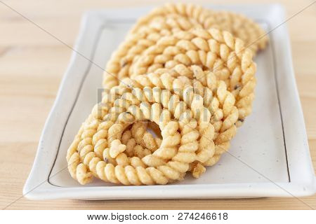 Chakli Or Murukku Popular Vegetarian Snack South India. Spiral Shaped Crisp Deep-fried Snack. Close