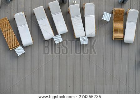 Wooden Plank Beds For Suntan At Hotel Standing On A Wooden Floor.top View