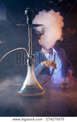 Clay Shisha Bowl With Craft Flawoured Tobacco And Red Hot Coconut Coil With Hookah Smoke Black Backg