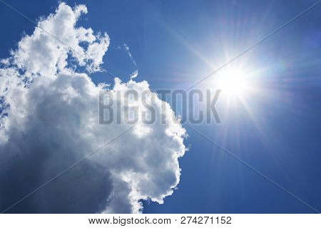 Bright White Clouds In The Sky Blue With Lonts And Rays On A Blue Background