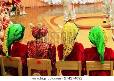Children In Fancy Dresses On Matinee At Kindergarten