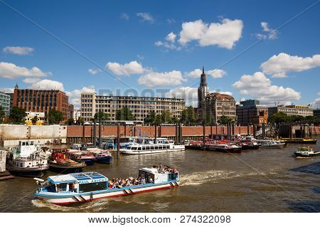 Hamburg, Germany - August 17, 2016 - Elbe River, Bridge, Buildings And Boats At Speicherstadt (wareh