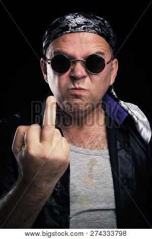 Rock star making facial expression and hand gesture