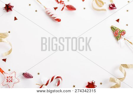 Christmas Composition. Xmas Pink Decor, Christmas Candy Cane With Ribbon On White Background.