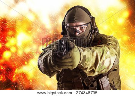 Fighter Of A Special Unit Is Aiming At The Sight Of The Machine Gun. Mixed Media