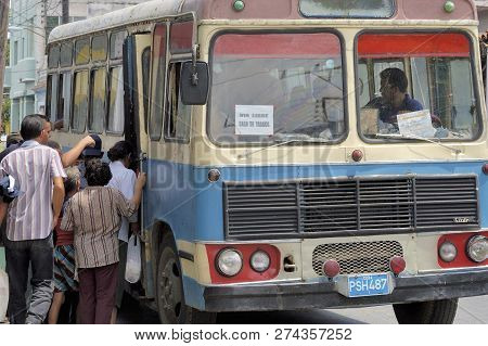 Havanna, Cuba-april 06, 2016: Passengers Boarding Bus For The Workers Of The Partagas Cigar Factory 