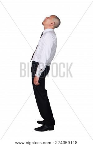 Young Businessman Wearing White Suit And Black Pants Deperate, Looking Up Gesture. Isolated On White