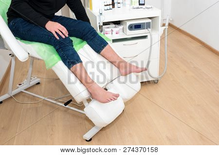 Podology Treatment. Patient Waiting For Doctor Podiatrist Or Dermatologist In Modern Clinic