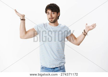 Confused Guy Not Knowing Answer, Being Clueless Raising Hands Sideways With Shoulder Shrug And Apolo