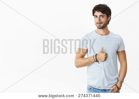 Nice Job, Keep Up. Portrait Of Satisfied Male Entrepreneur With Charming Blue Eyes And Beard Smiling