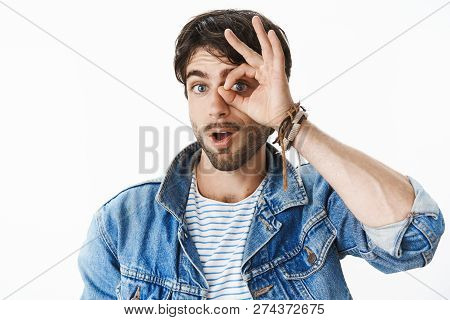 Studio Shot Of Charismatic And Joyful Handsome European Man With Blue Eyes Showing Zero Or Null With