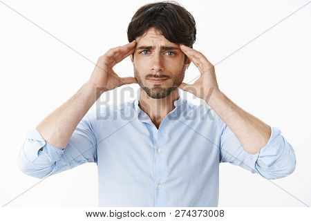 Guy Cannot Concentrate And Focus On Work As Having Migraine Or Headache Smirking Upset Holding Hands
