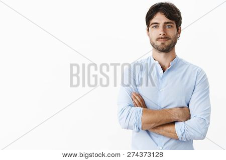 Waist-up Shot Of Confident Successful Handsome Entrepreneur With Blue Eyes And Bristle In Blue Shirt