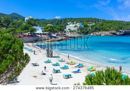 Ibiza, Spain - May 19, 2013:  Tourists In The Beach Of Cala Xarraca