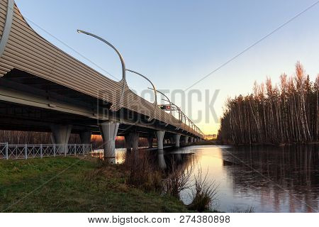 Flyover Of The Highway Over River At Sunset