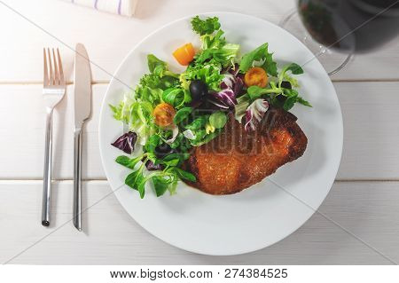 Boston Butt Steak With Fresh Leaf Salad. Top View