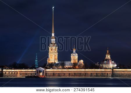 Beautiful Night View From The Embankment Of The Neva River To The Peter And Paul Fortress, Located O
