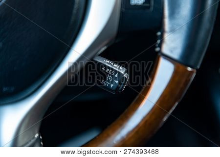 The Shift Lever To Set The Automatic Cruise Control Speed Inside The Car Close-up Located Near The S