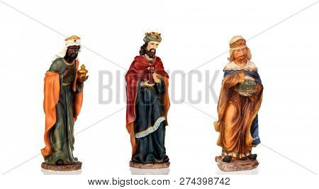 The three wise men. Ceramic figures isolated on white background
