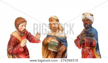 The three wise men. Ceramic figures isolated on white background
