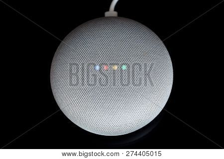 Paris, France - December 17 2018: Overhead View Of A Google Home Mini With Cable (chalk Color), Blac