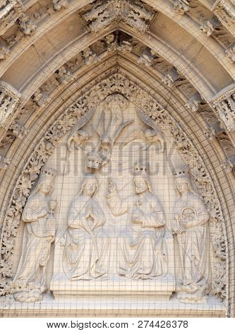 WURZBURG, GERMANY - JULY O4, 2018: The tympanum shows the Coronation of the Virgin portal of the Marienkapelle in Wurzburg, Bavaria, Germany