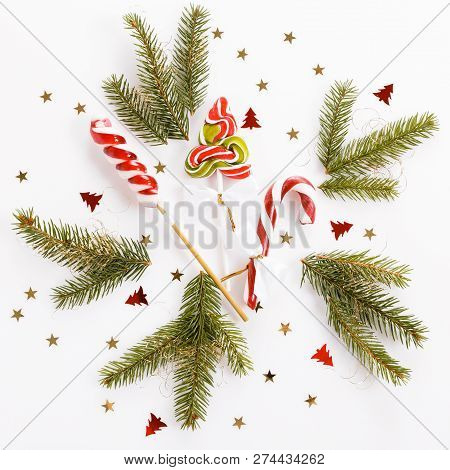 Christmas Composition. Xmas Pink Decor, Christmas Candy Cane With Ribbon On White Background.