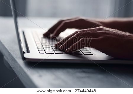 Close Up.hand Of A Businessman Pressing Button On Laptop Keyboar