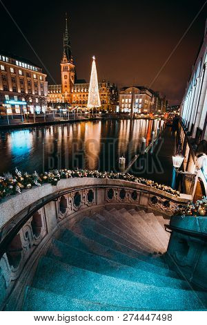 Christmas Market On The Town Hall Square. Decorated Alsterfleet Stairs And Beautiful Illuminated X-m