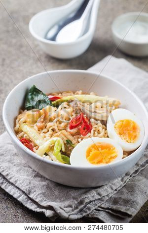 Japanese Ramen Noodle With Chicken, Shiitake Mushroms And Egg In White Bowl