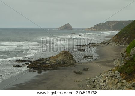 Beautiful Rock In The Center Of Los Quebrantos Beach On A Rainy Day. July 30, 2015. Landscapes, Natu