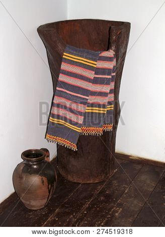 A Big Wooden Vat And Towels And A Wine Jug In The Basement Of A Traditional Bulgarian Village House,