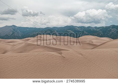 A Thunderstorm Rolling In Over The Giant Desert Sand Dunes Of Great Sand Dunes National Park In Colo