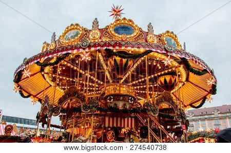 Dresden, Germany - December 14, 2018: View Of The Christmas Carousel, Toys And Scenery Houses On The