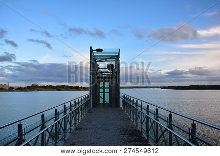 City Embankment Near The Lake With Equipped Infrastructure For Recreation. Lift On The Lake Mastis Q