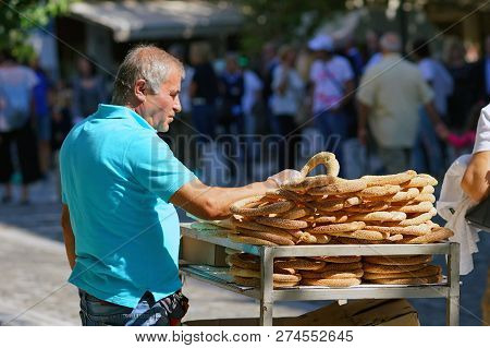 Greece, Athens - October 07, 2018 Donut Seller, Koulourakia, On The Street In Plaka District