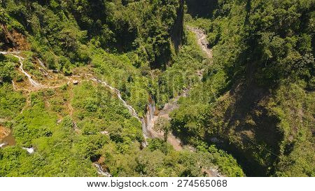 Beautiful Waterfall Coban Sewu In Tropical Forest, Java Indonesia. Aerial View Tumpak Sewu Waterfall