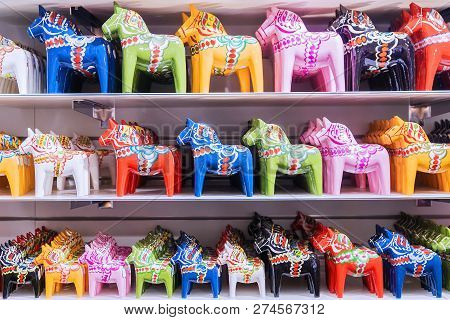 Multicolored Painted Wooden Horses. Souvenir From Sweden